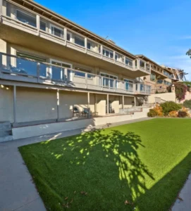 Exterior of a residential treatment facility with a green lawn