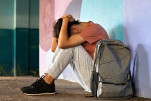 Individual displaying visible physical signs and health effects of methamphetamine use and addiction