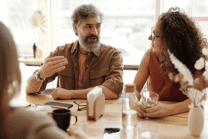 Man and woman discussing rehab options during a consultation